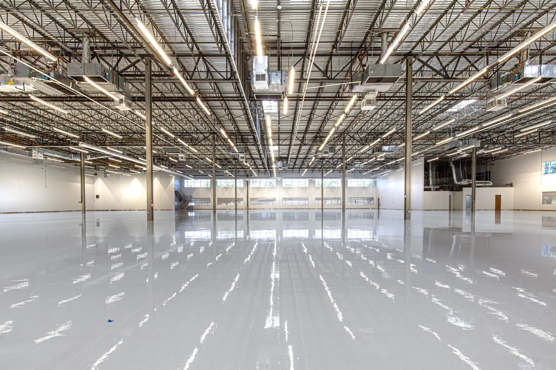 Finished solid-color epoxy floor in an industrial facility
